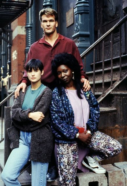 three people are posing for a photo on the steps