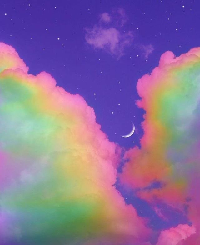 the sky is filled with colorful clouds and a half moon in the distance above it