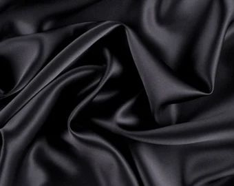 the black fabric is very soft and shiny