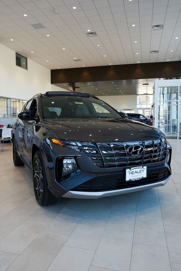 an suv is parked in a showroom