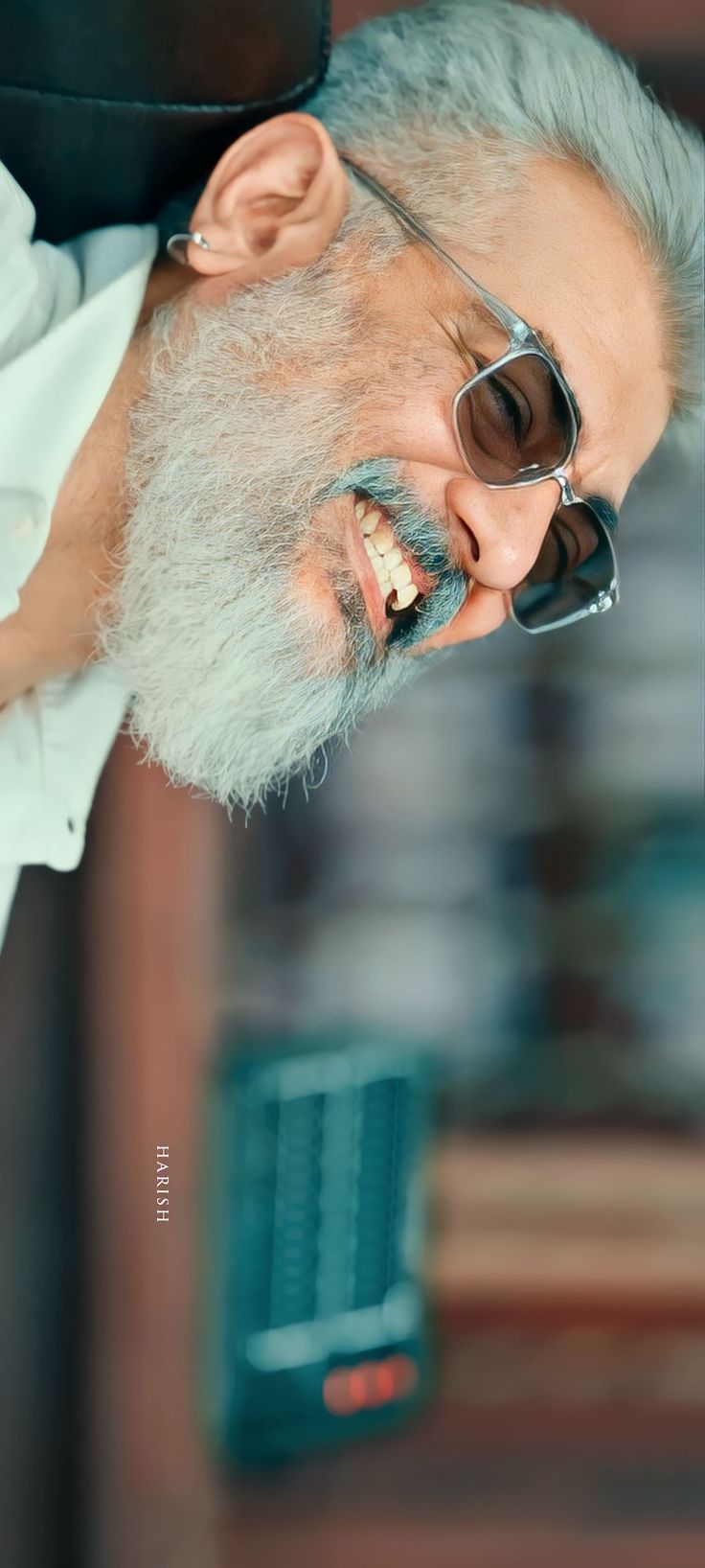 an old man wearing sunglasses and a white beard