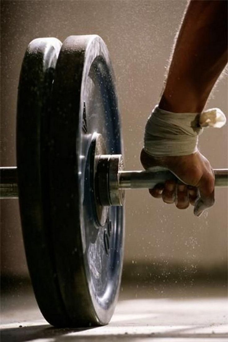 a person holding a barbell in their hand