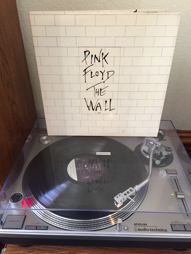 a record player with pink floyd the wall on it