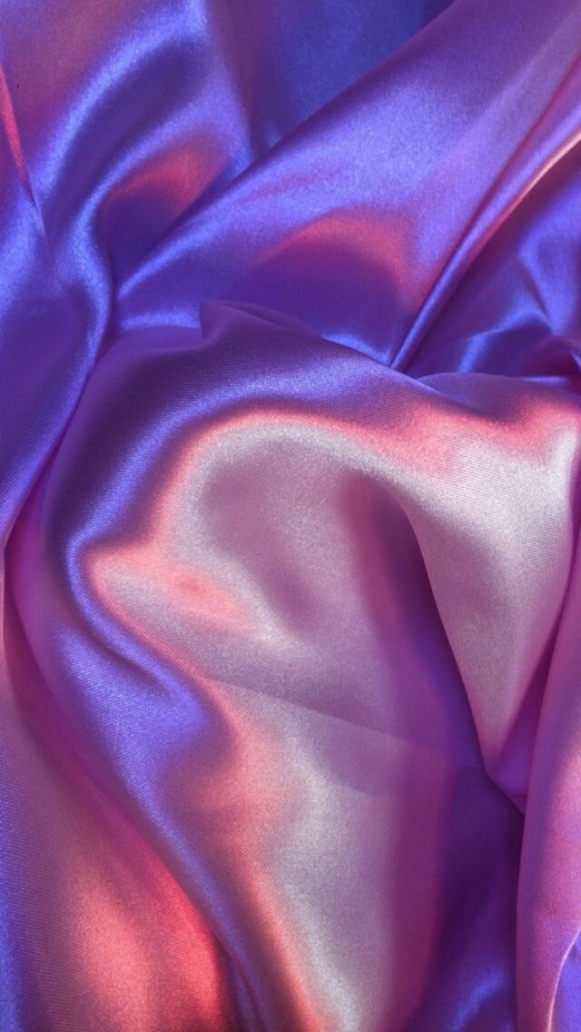 a close up view of a purple satin fabric