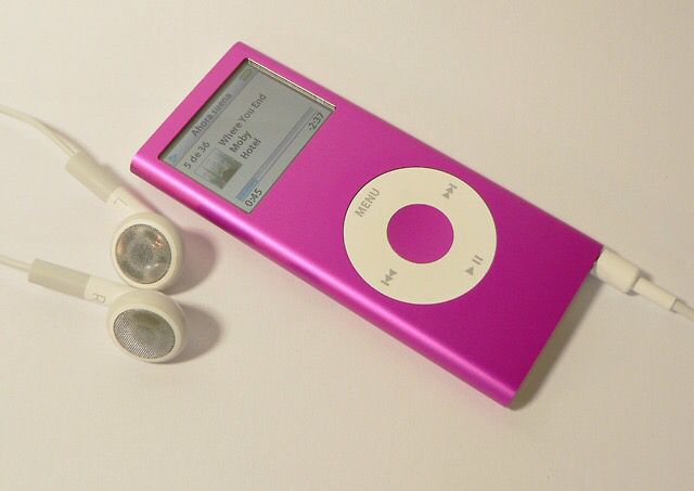 an ipod and headphones sitting on a table