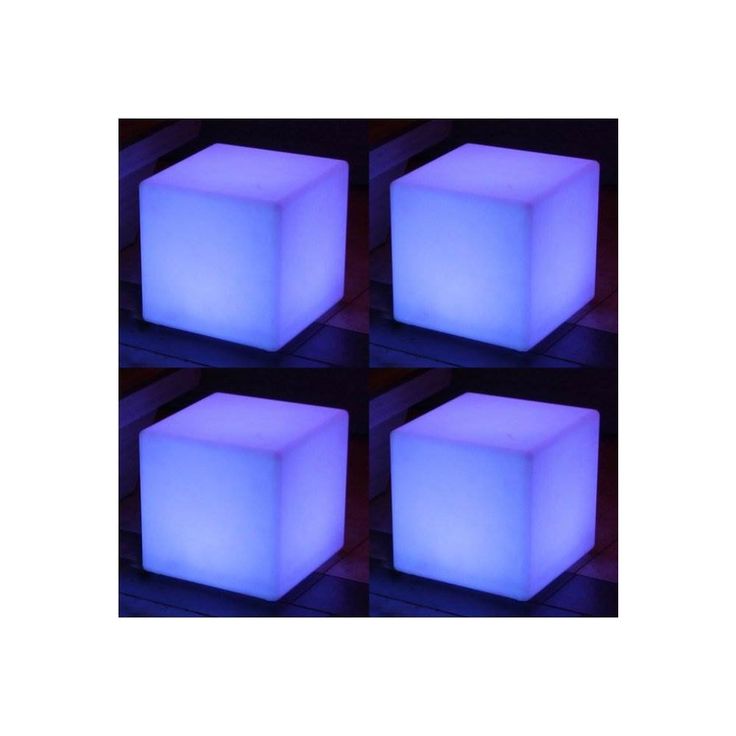 four square cubes are lit up in the dark with blue light on each side