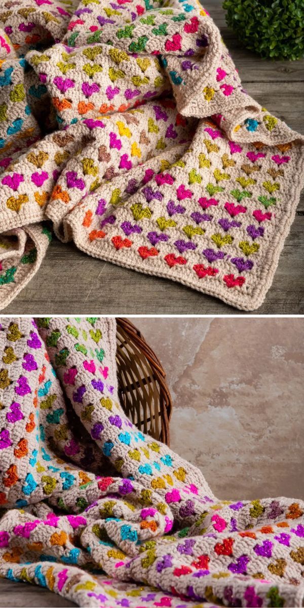 crocheted blanket with flowers on it laying on the floor next to a wicker basket