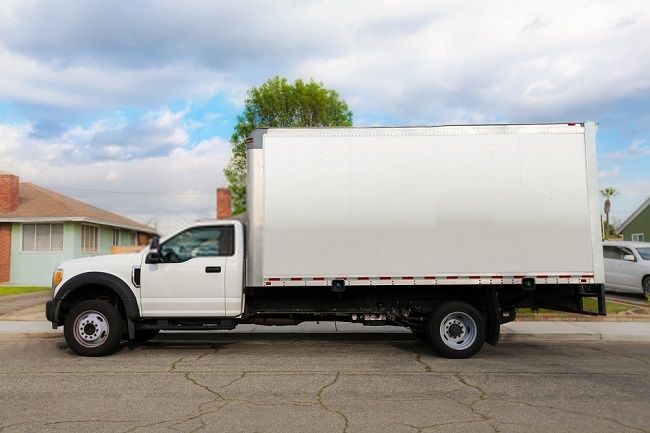 a white truck is parked on the street