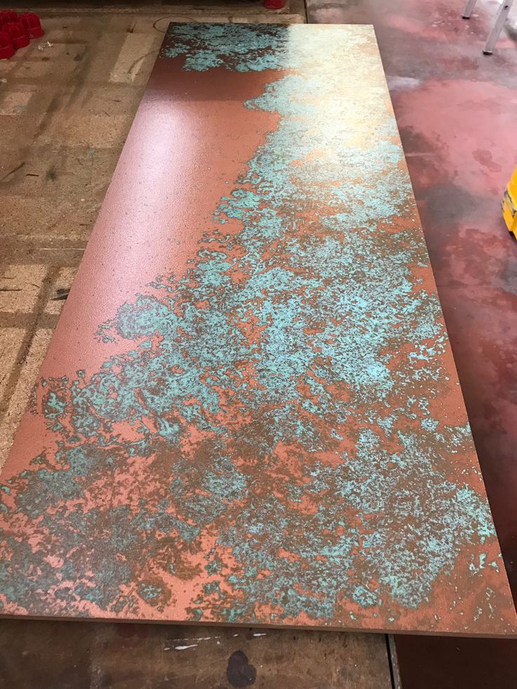 the table is covered with blue and green paint