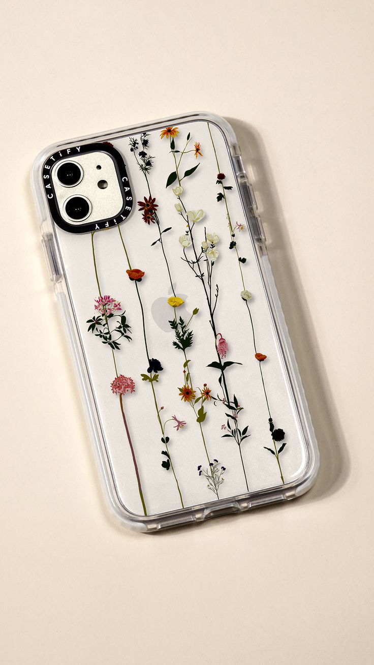 an iphone case with pressed flowers on it