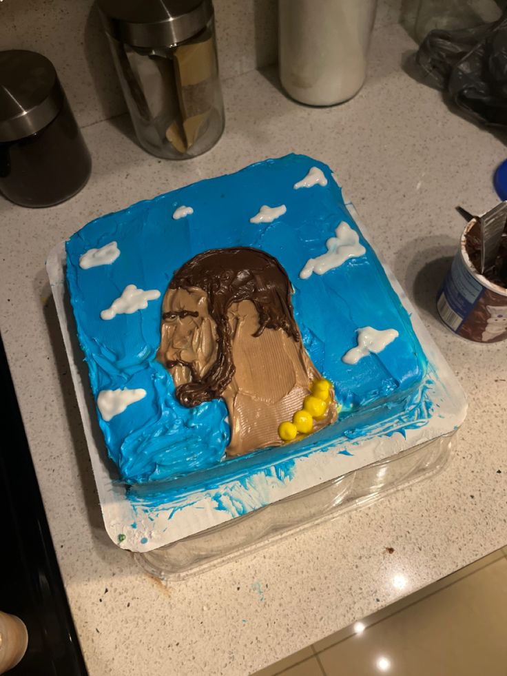 there is a cake that looks like a bear in the sky with clouds on it