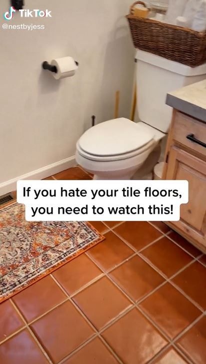 a bathroom with a toilet, sink and rug on the floor that says if you hate your tile floors, you need to watch this