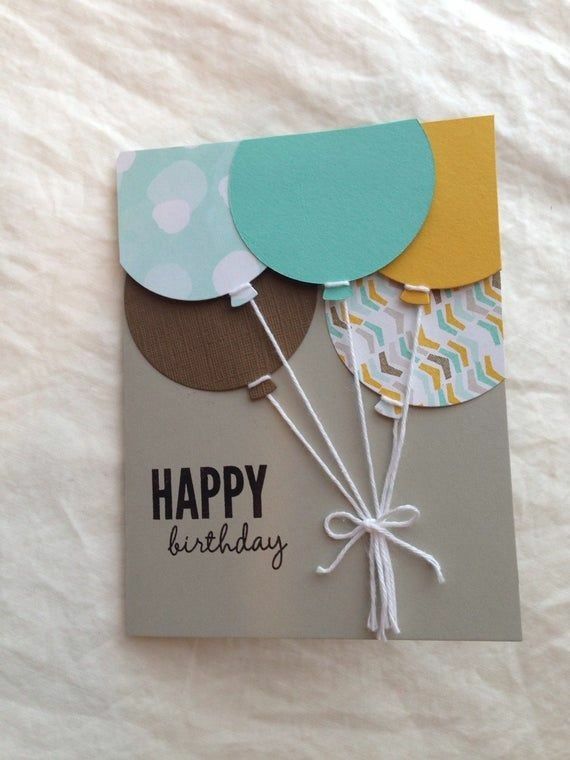 a happy birthday card with balloons attached to it