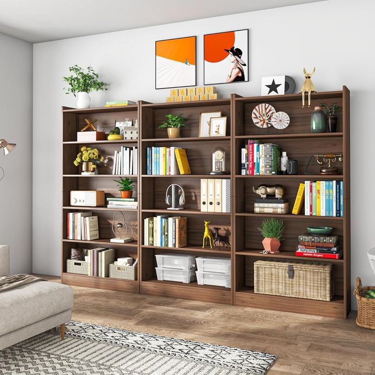 a living room filled with lots of bookshelves next to a white couch in front of a window