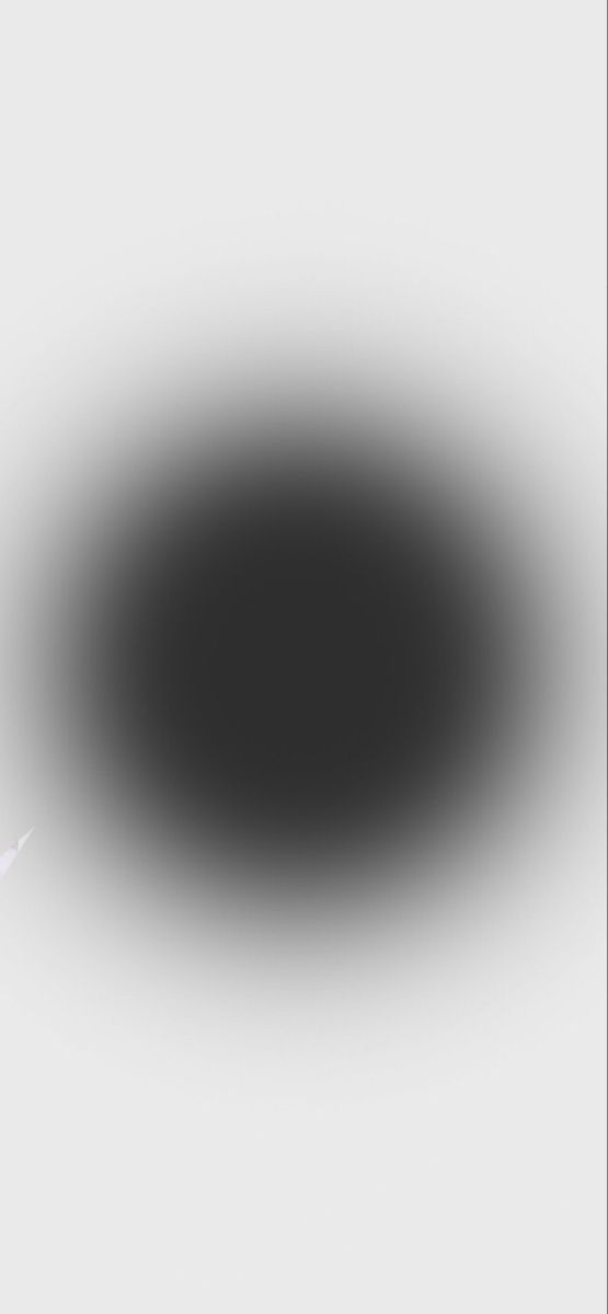 a black and white photo of an object in the middle of the image, it appears to be very dark