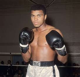 a man with boxing gloves standing in front of a sign that says the champion $ 7 20