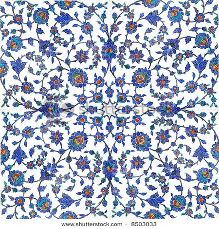 an intricately designed tile with blue and orange flowers on white ground, in the middle of