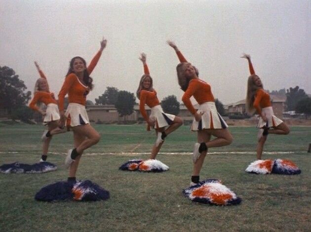 the cheerleaders are doing stunts on their pom - poms