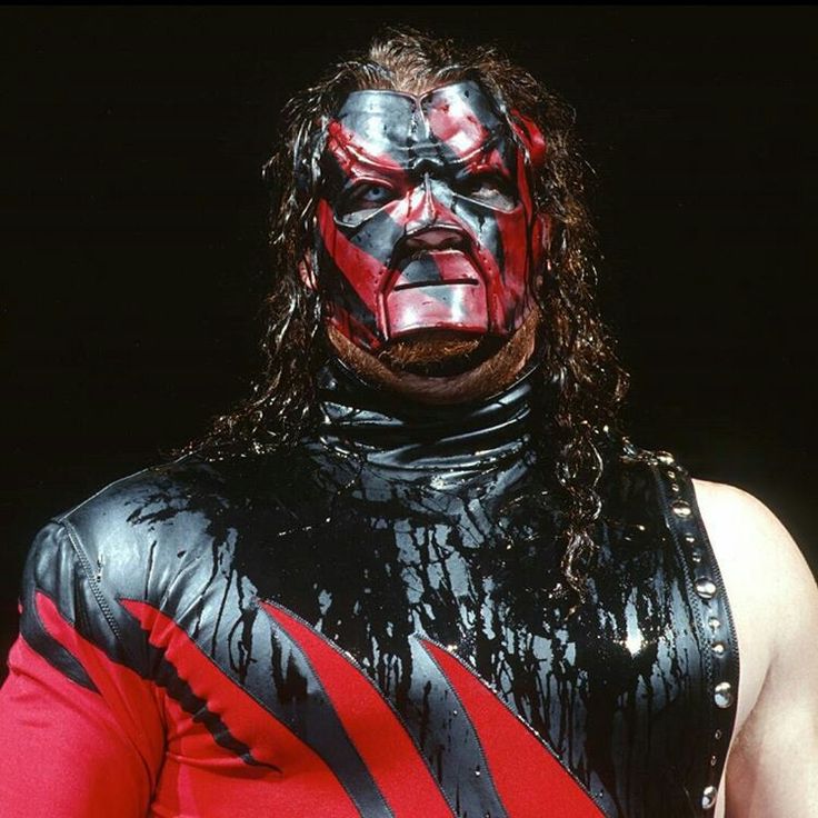 a wrestler with red and black paint on his face