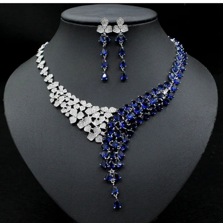 This Necklace Is Beautifully Crafted And Very Eye Catching Set For Your Evening Wearing. Very Very Shinny V-Line Set Looks More Beautiful Than It Looks On These Pictures. Note The Necklace Isn't Adjustable And Can Fit 16 To 17 Inch Neckline. Silver Aesthetic Jewelry, Extravagant Necklace, Blue Sapphire Jewelry Set, Necklace Design Ideas, Sapphire Jewelry Set, Wedding Studs, Solving Equations, V Line, Bling Necklace