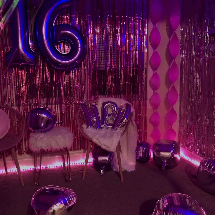 a room filled with shiny balloons and chairs