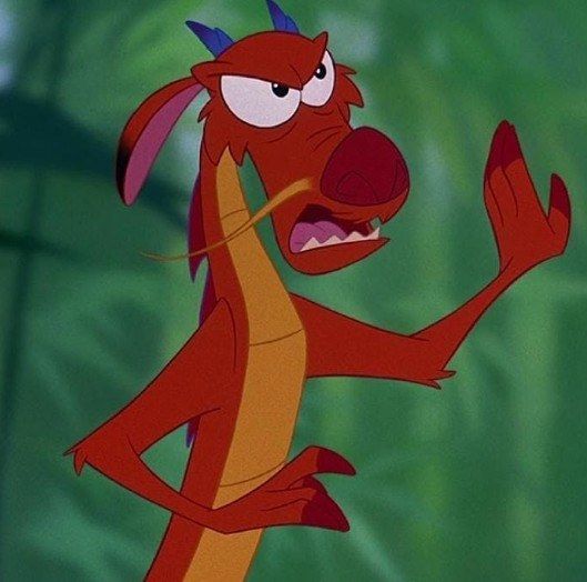the red dog from disney's beauty and the beast is pointing at something in his mouth