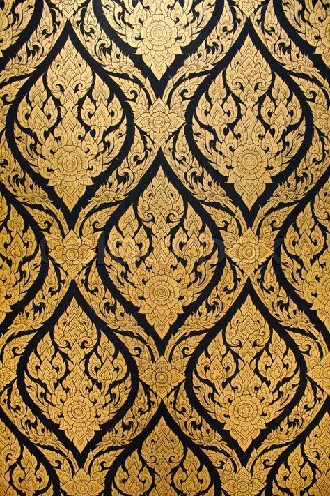an ornate gold and black wallpaper with intricate designs on it's surface,