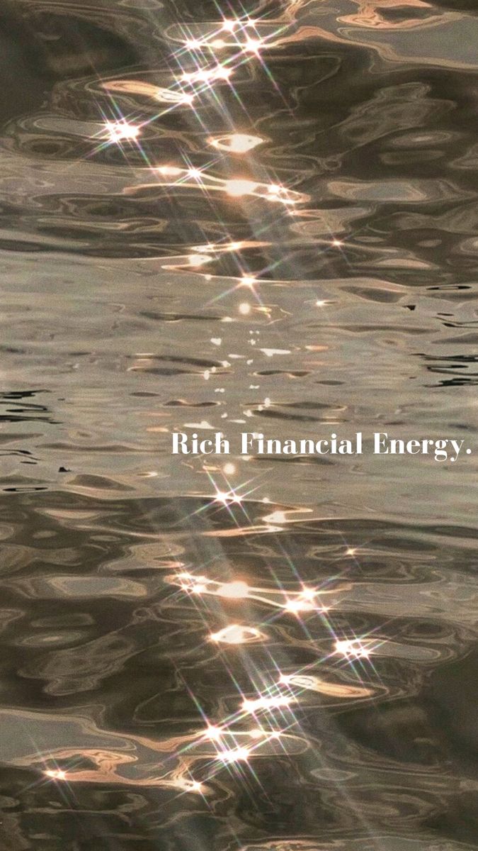 the words rich financial energy are reflected in water with sunbeams and reflections on it