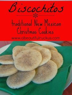 traditional new mexican christmas cookies on a white plate with green napkin and red sign that says biscocits
