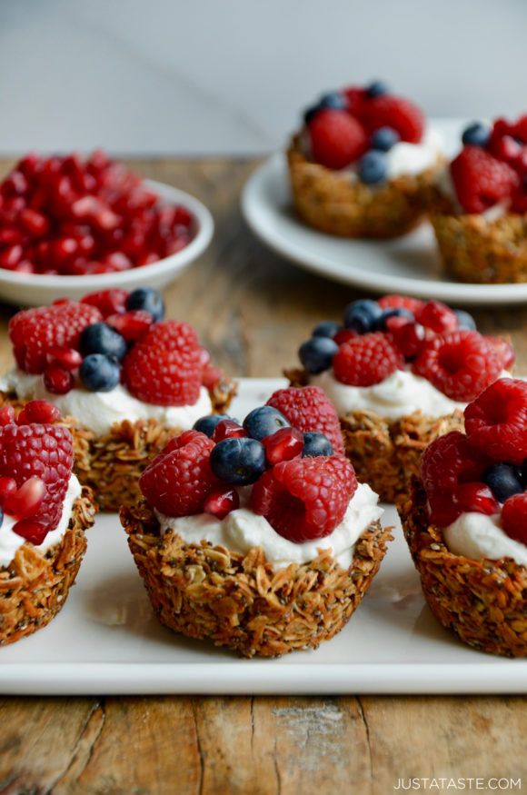 small cupcakes with berries and yogurt on top