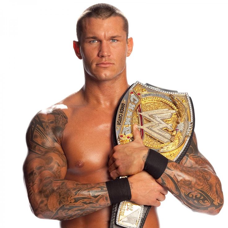 a man with tattoos holding up a wrestling ring and looking at the camera while standing in front of a white background
