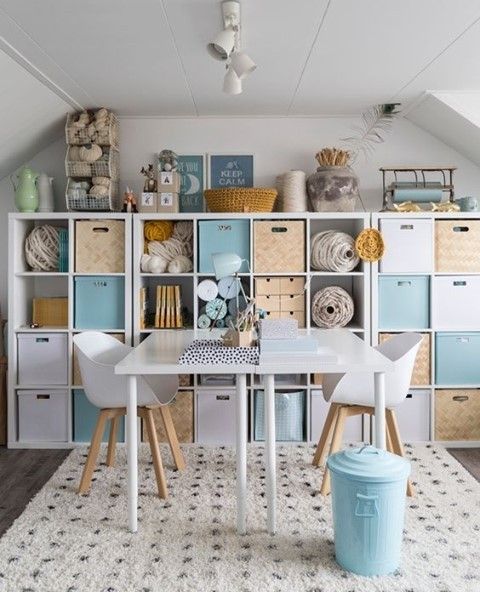 a room filled with lots of white furniture and storage containers on top of each other