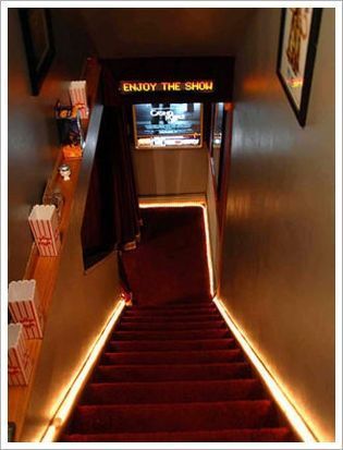 the stairs lead up to an exit way with signs above them that read enjoy the show