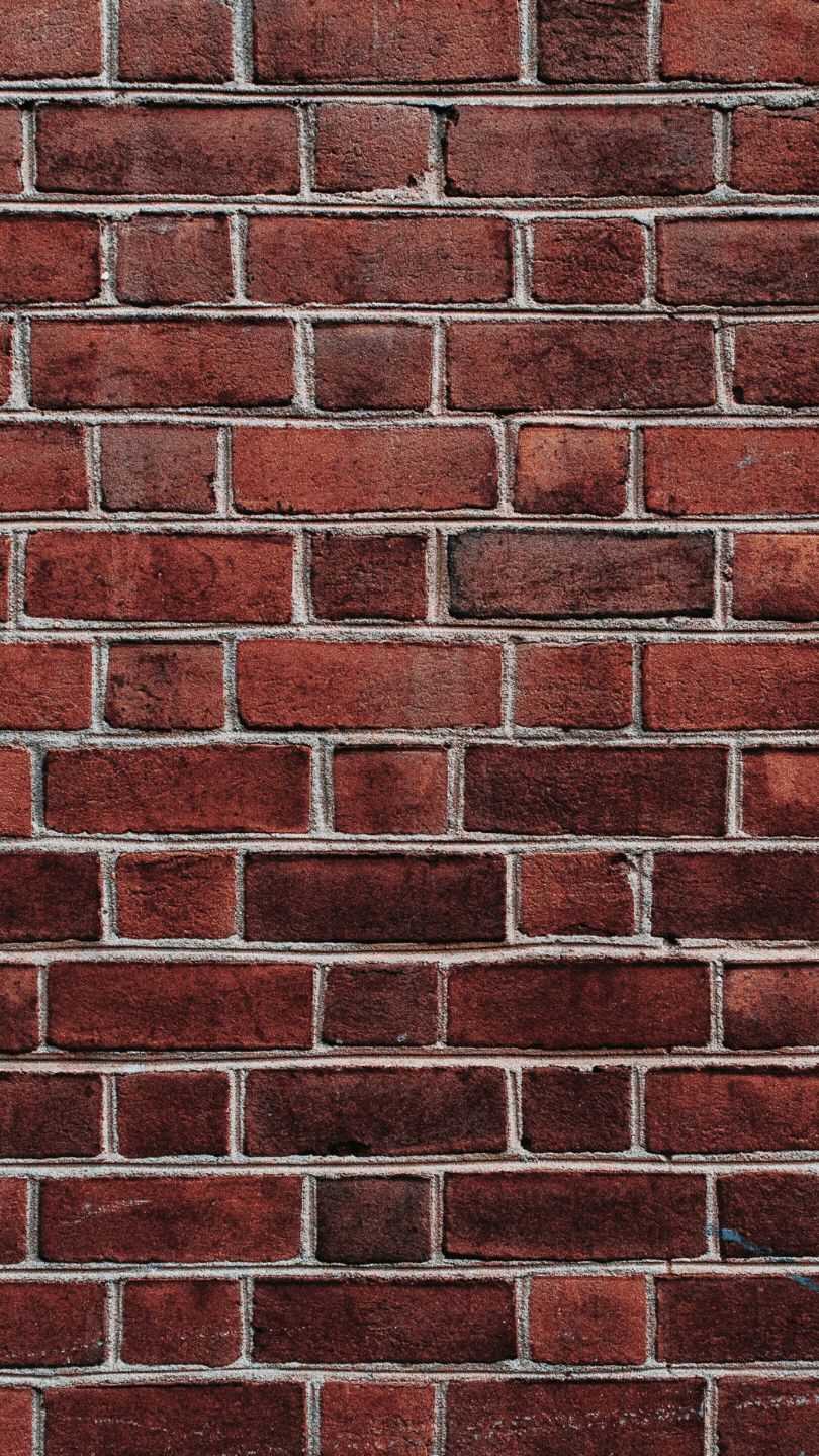 a red brick wall is shown with no mortar