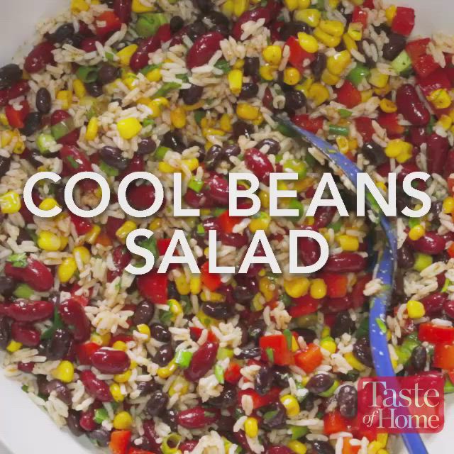 This may contain: a bowl filled with rice, beans and corn next to a blue spoon that says cool beans salad