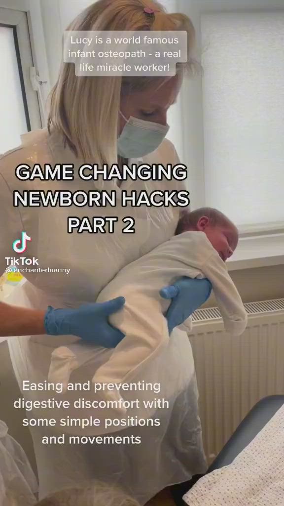 This may contain: a woman holding a baby in her arms with the caption game changing newborn hacks part 2