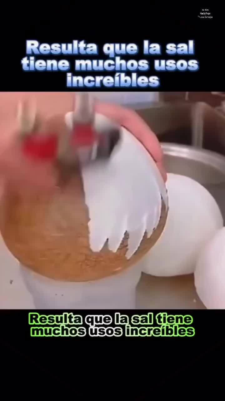 This may contain: a person is peeling an egg with a knife