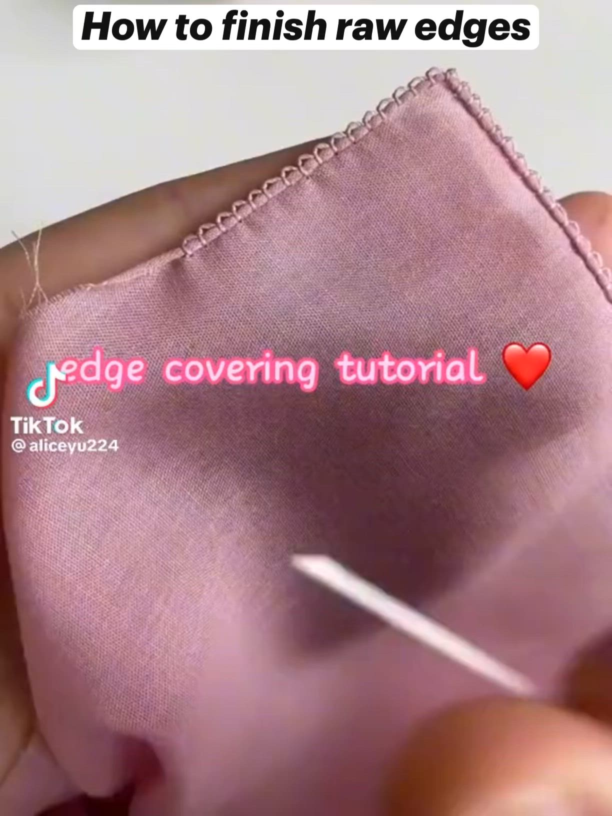 This may contain: someone is stitching the edge of a pink fabric