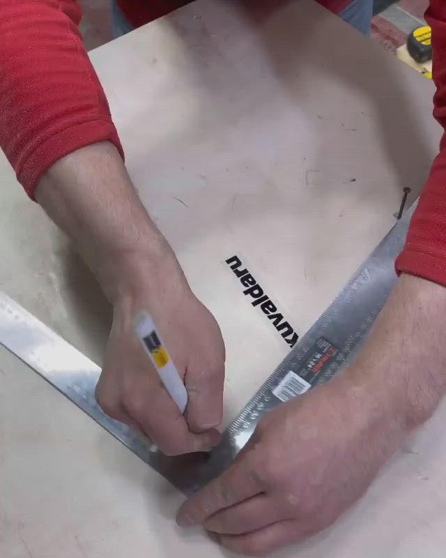 This may contain: a person using a ruler to cut a circle