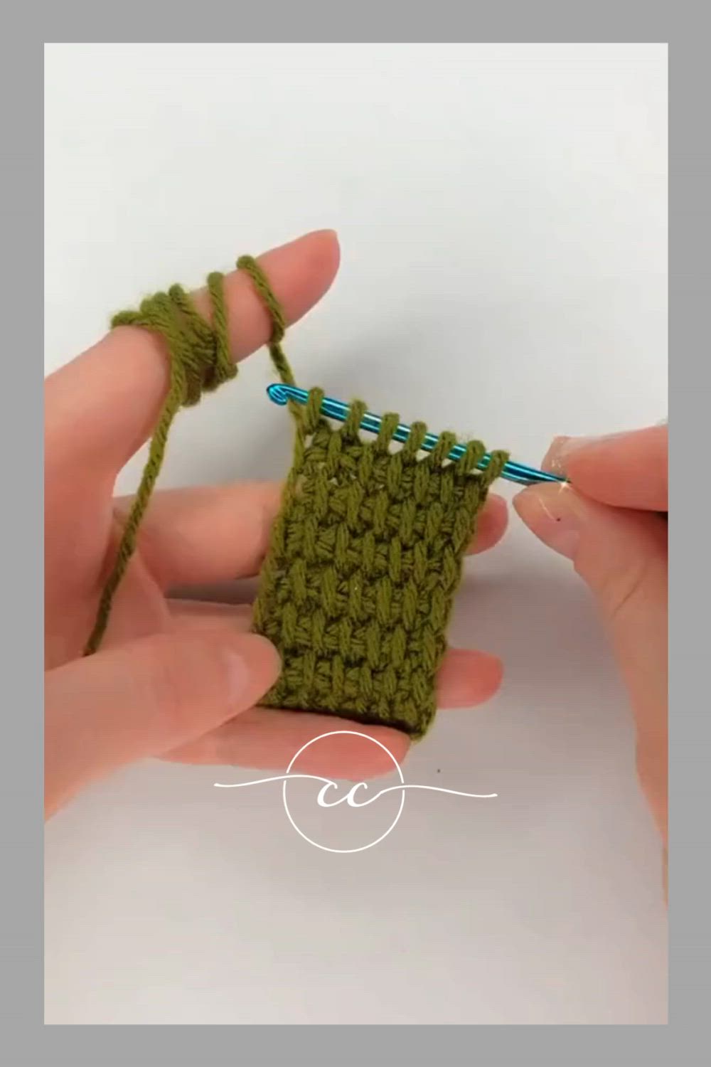 This may contain: two hands are holding a green crocheted object