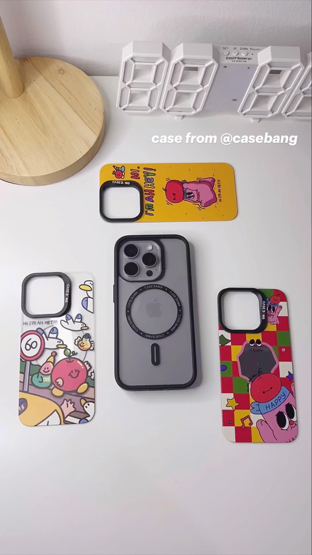 This may contain: three cell phones are sitting on a table next to each other, and there is a case from @ caso bang