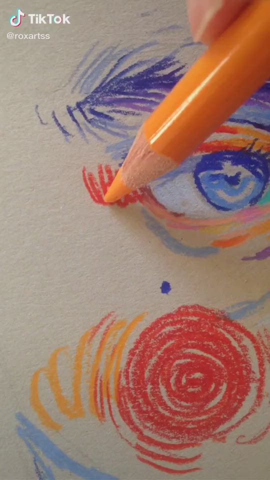 This may contain: someone is drawing with colored pencils on paper