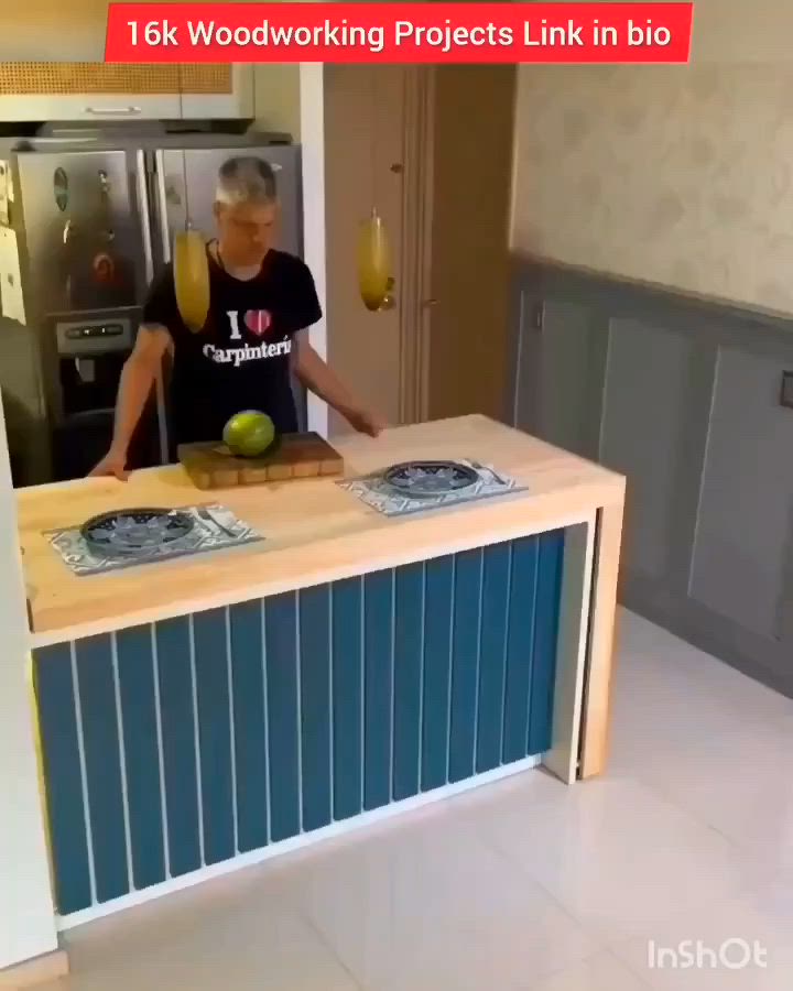 This may contain: a man standing in front of a kitchen counter with an apple on top of it