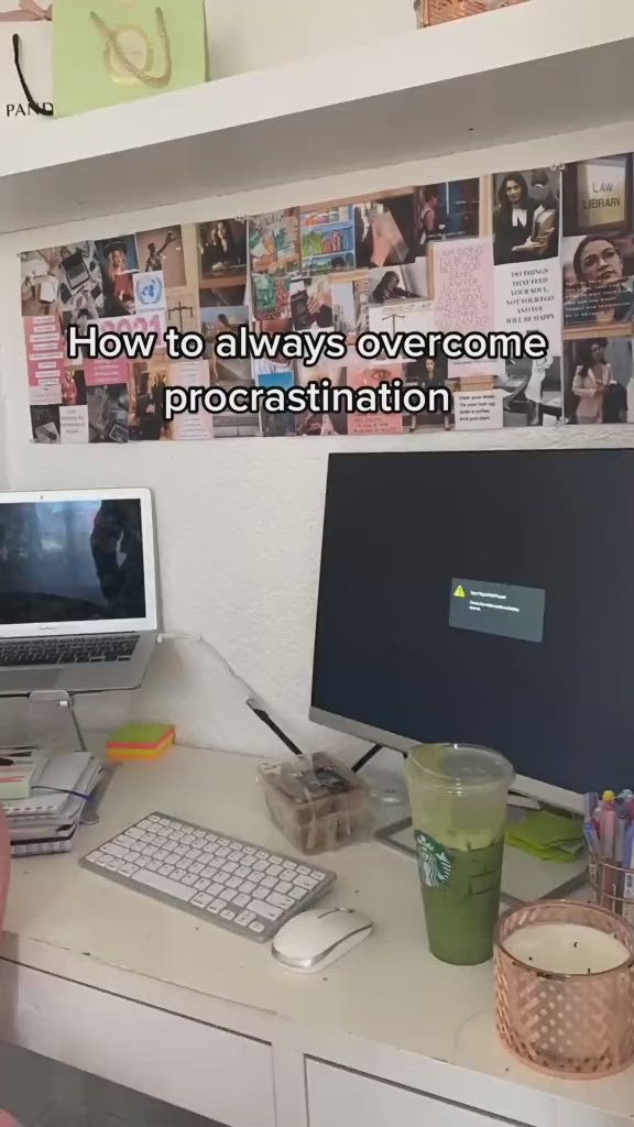 This may contain: a person sitting at a desk with two computer screens