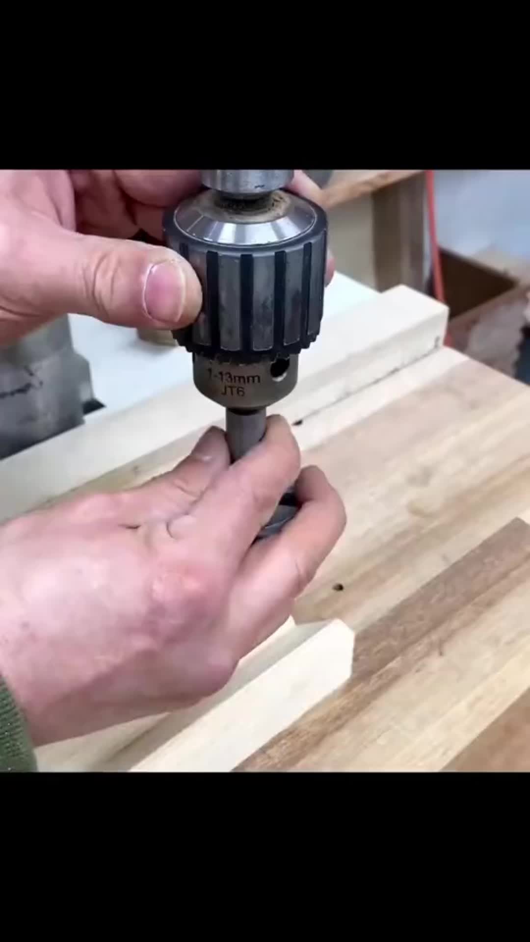 This may contain: a person is working on a piece of wood