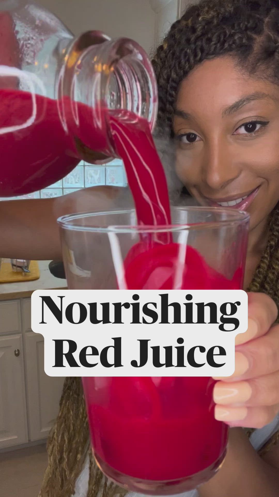 This may contain: a woman pouring red juice into a glass in her kitchen with the words nourishing red juice