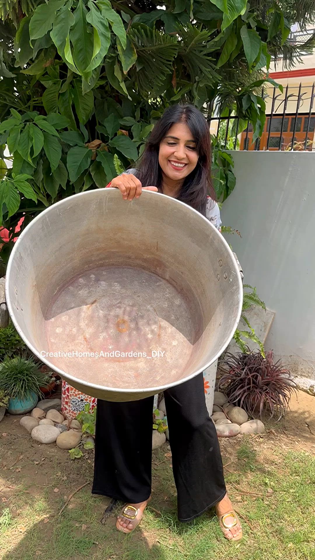 This may contain: a fish bowl filled with water and plants