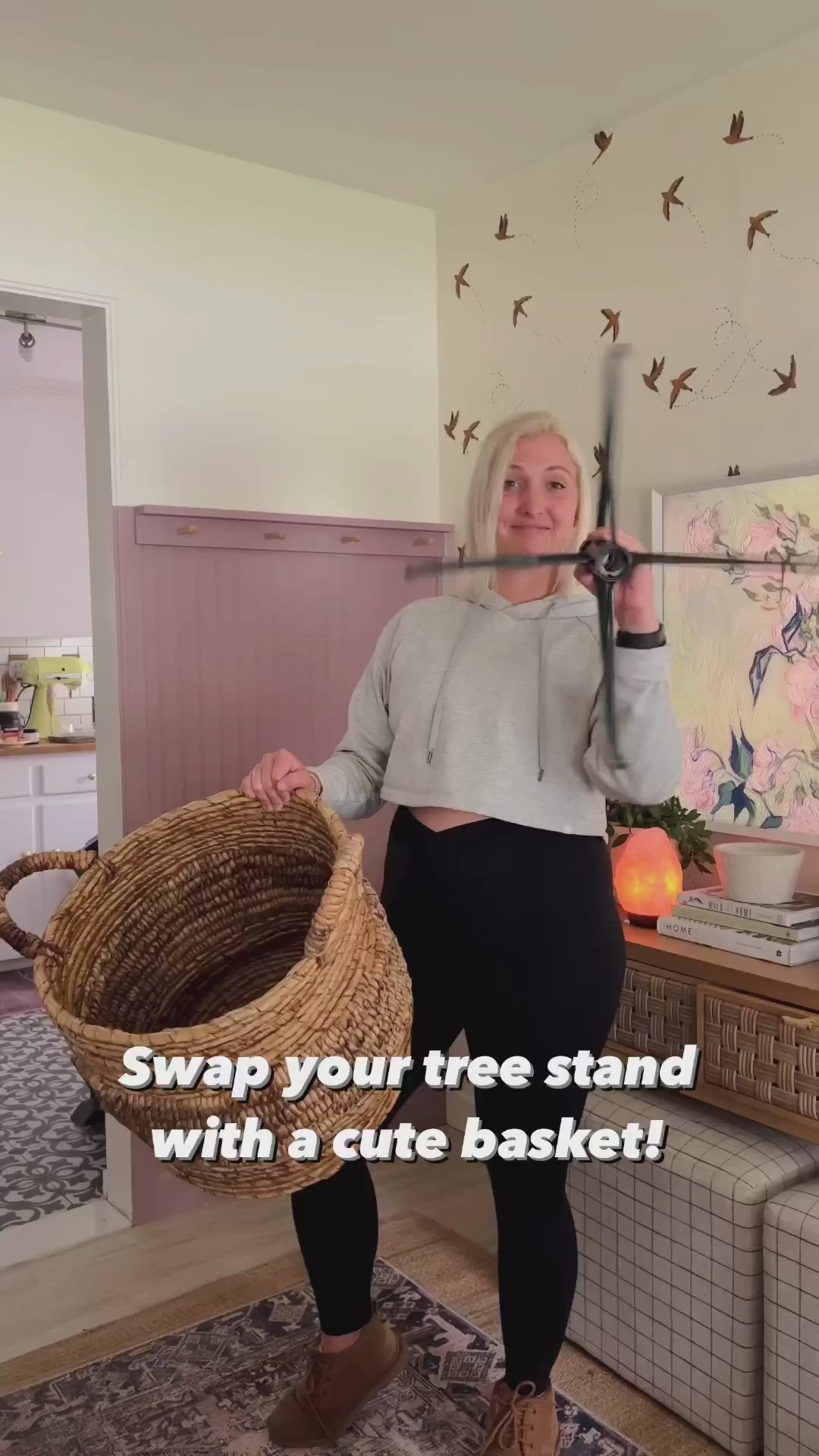 This may contain: a woman holding a basket in her hands with the words swap your tree stand with a cute basket