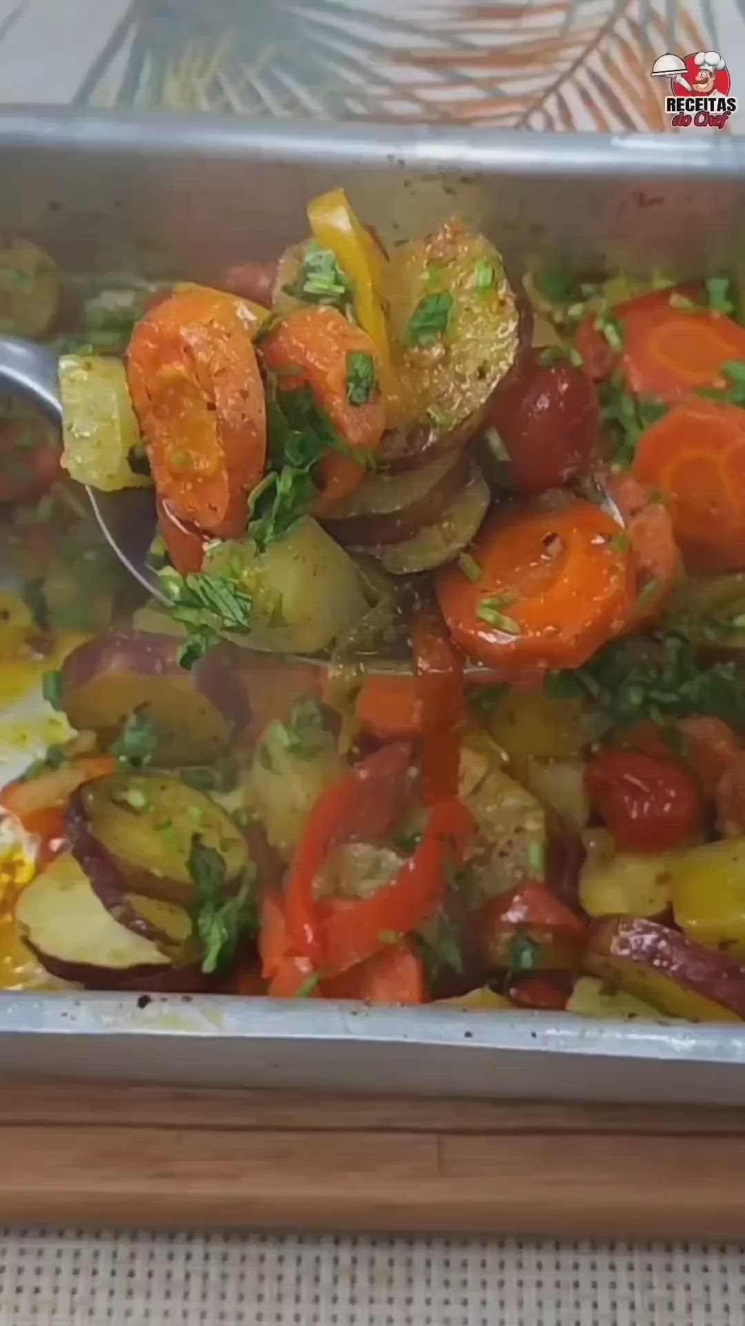 This may contain: a metal pan filled with vegetables on top of a table