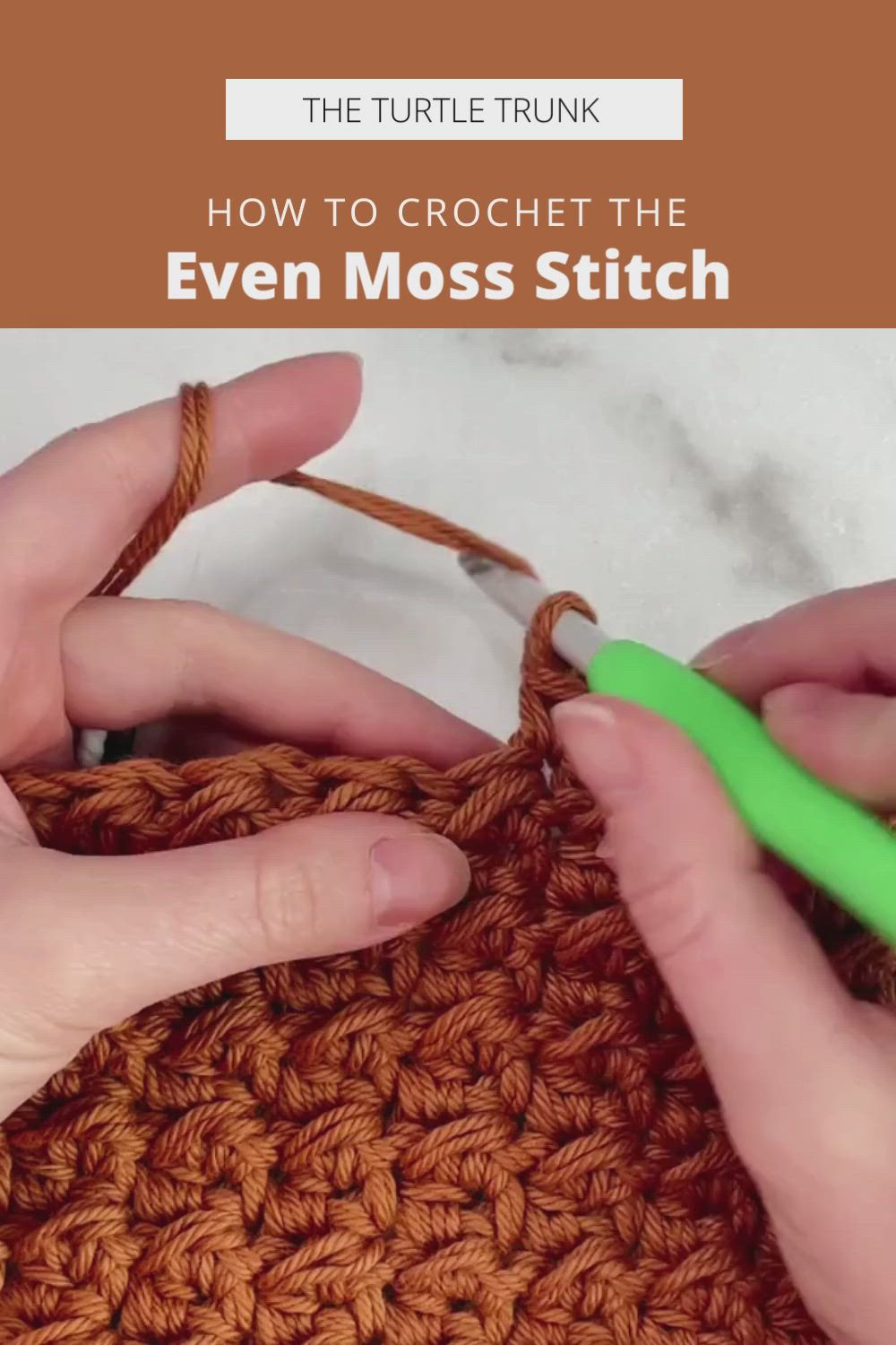 This may contain: two hands crochet the even moss stitch on an orange piece of yarn with green scissors